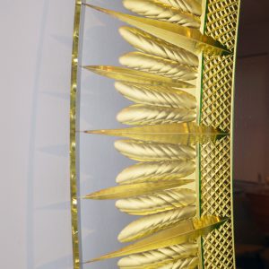 Mirror by Cristal Art, Italy c. 1960. Hand carved and gilt in a stylized feather motif, with a border of clear glass. 33.5 inches x 23.75 inches. GoodDesignShop.com reference number GDF-059