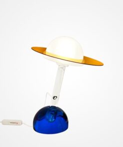 Plutone table lamp by Daniela Puppa for Fontana Arte, model 2701. Italy 1981. Clear glass stem with white diffuser fitted with amber ring, mounted in blue glass base. Sold with original certificate of authenticity. 16 inches high, 12.5 inches wide, 12.5 inches deep.